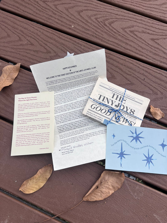 Poetry, letters and postcards on a wooden surface with leaves